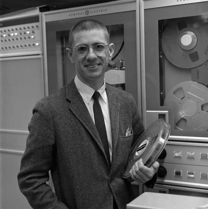Thomas E. Kurtz in front of tape drives