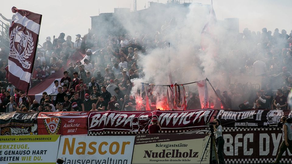 Fans repeatedly set off pyrotechnics during the game between BFC Dynamo Berlin and Energie Cottbus